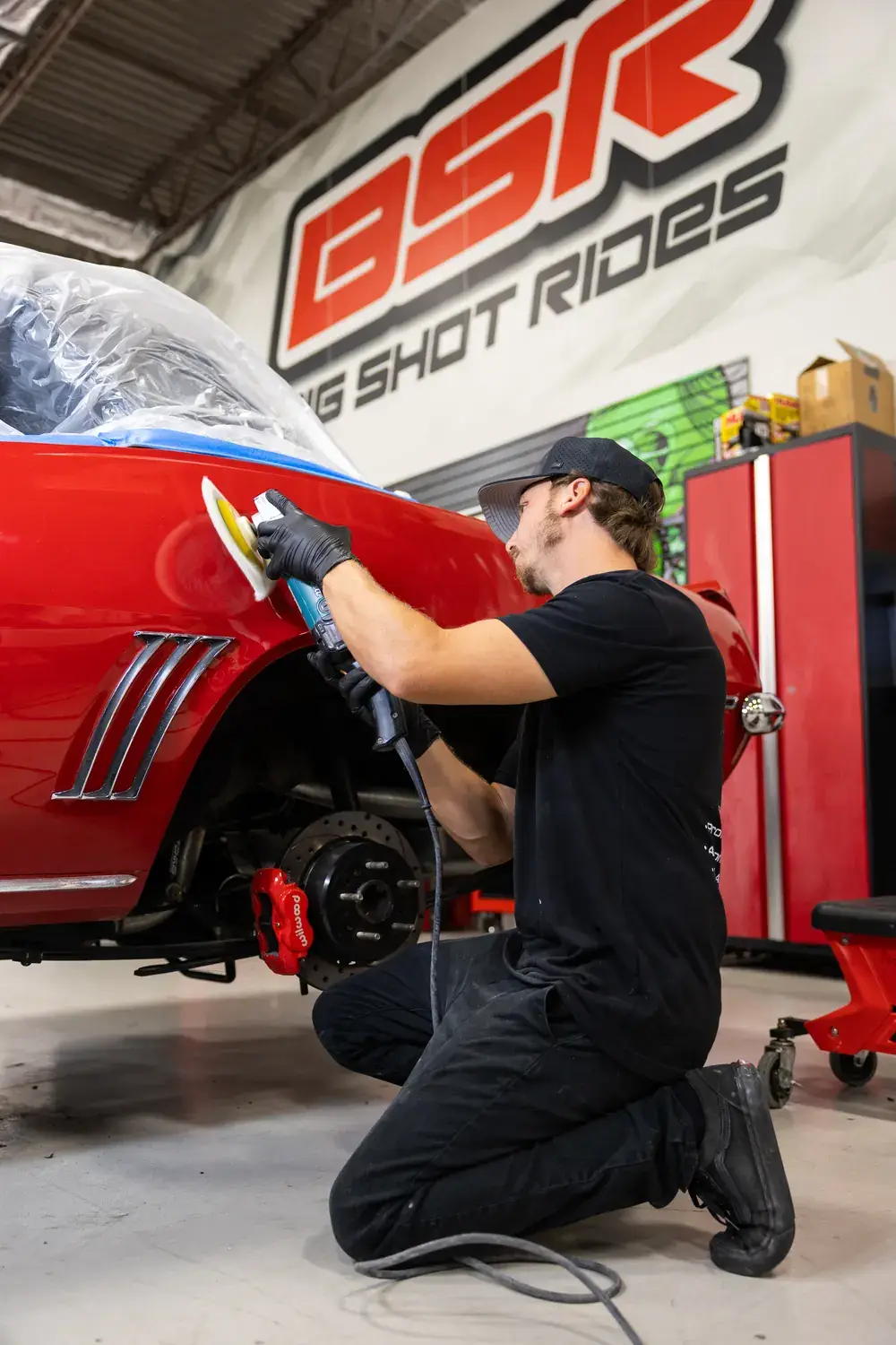 Machine polishing a classic Camaro before ceramic coating at Big Shot Rides