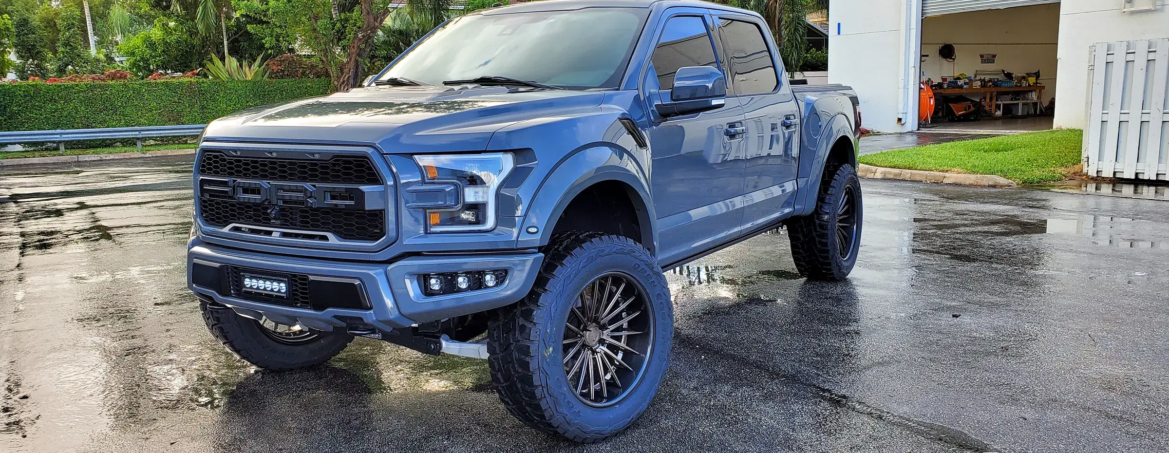 Rigid bumper light bar and pod lights installed on a lifted Ford Raptor at Big Shot Rides, Coconut Creek FL