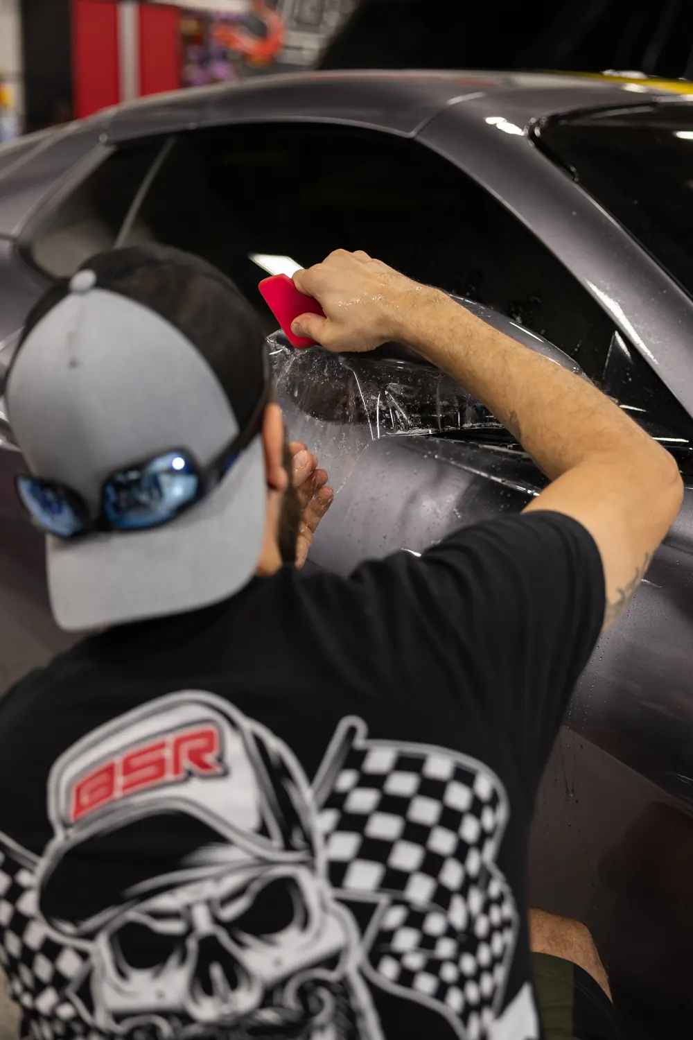 Squeegee work on paint protection film at Big Shot Rides