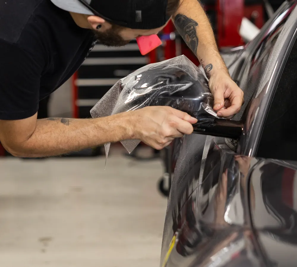 Paint protection film detail work on a Ferrari at Big Shot Rides