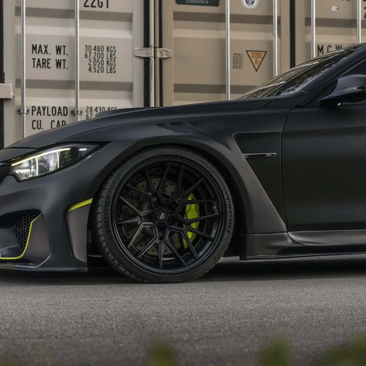 BMW M4 forged wheel and coilover detail with lime accents at Big Shot Rides