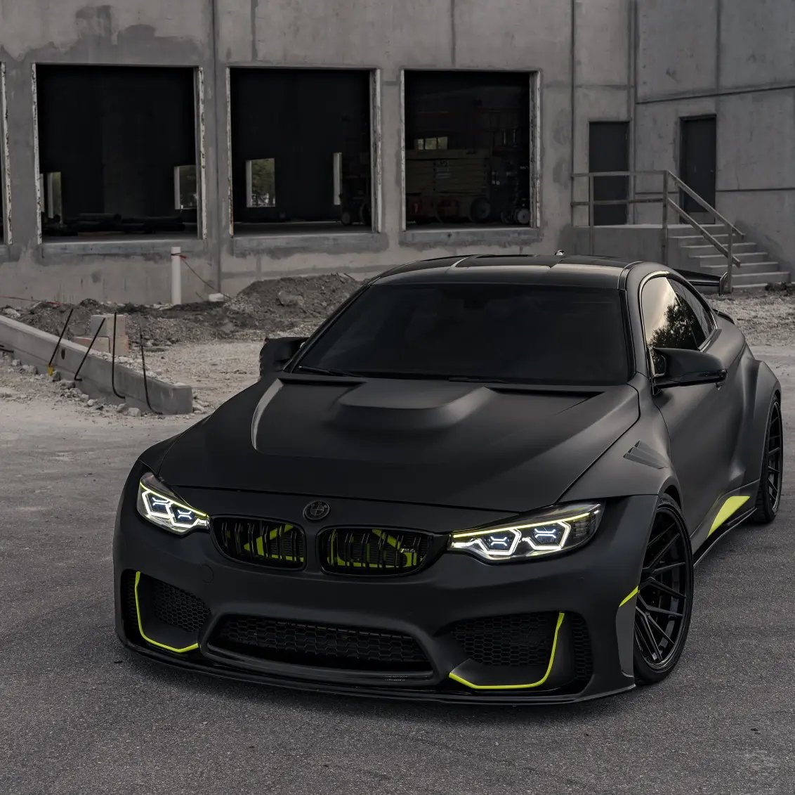 Matte black BMW M4 widebody with lime green accents at Big Shot Rides