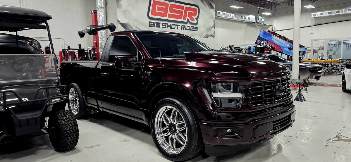 Maroon Ford F-150 single cab with custom wheels and tires at Big Shot Rides Coconut Creek