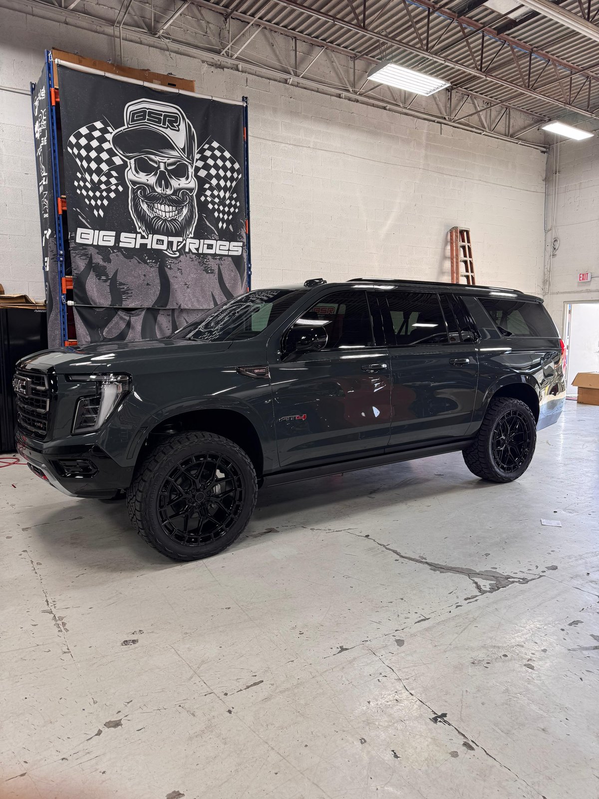 Gray lifted GMC Yukon SUV at Big Shot Rides Coconut Creek