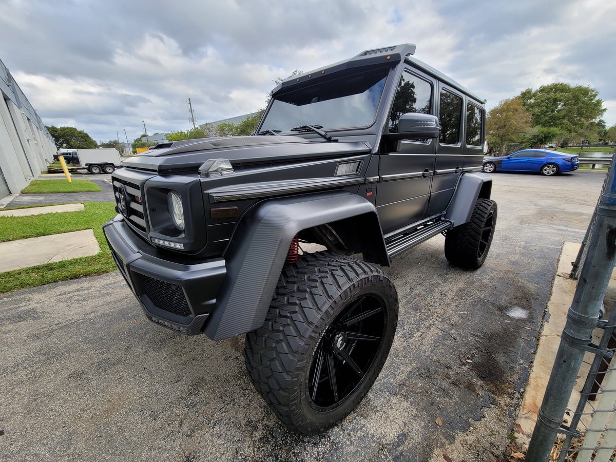 Custom matte Mercedes G-Wagon with running boards and aftermarket side steps at Big Shot Rides