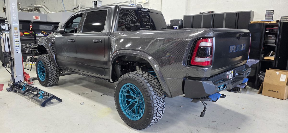 RAM TRX with carbon body panels and teal forged wheels in Big Shot Rides full custom build
