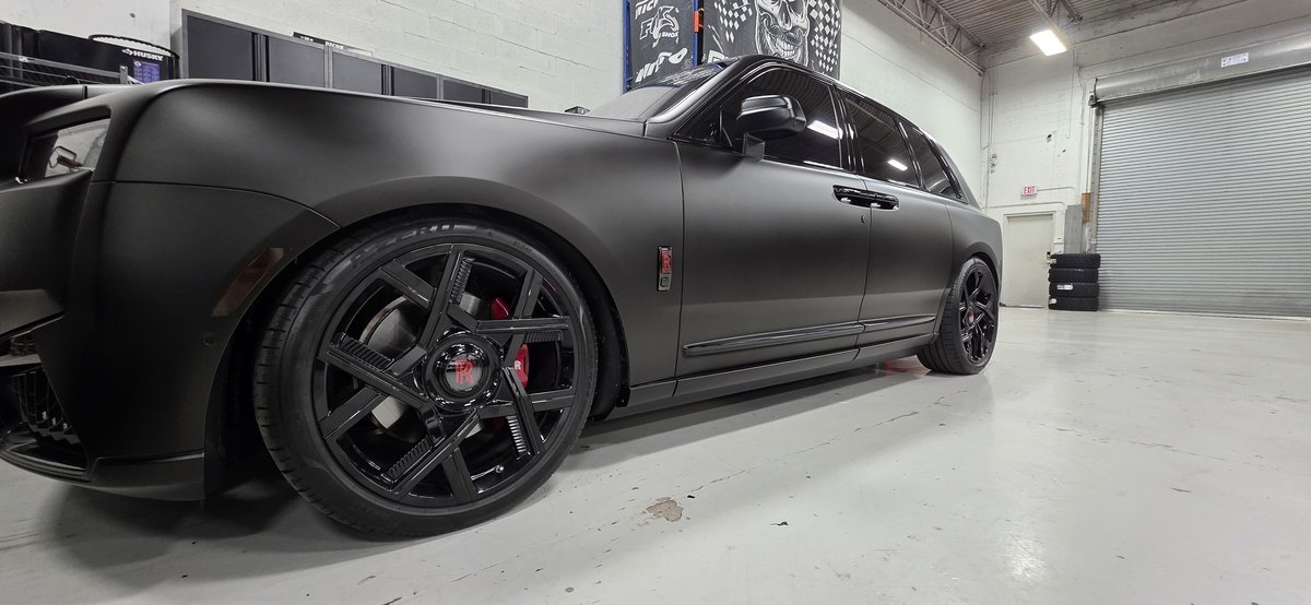 Matte black Rolls-Royce Cullinan lowered on black forged wheels at Big Shot Rides Coconut Creek
