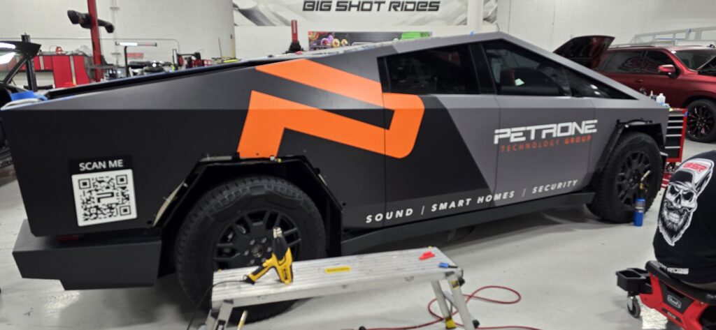 Tesla Cybertruck with a commercial branding wrap installed by Big Shot Rides in Coconut Creek, Florida