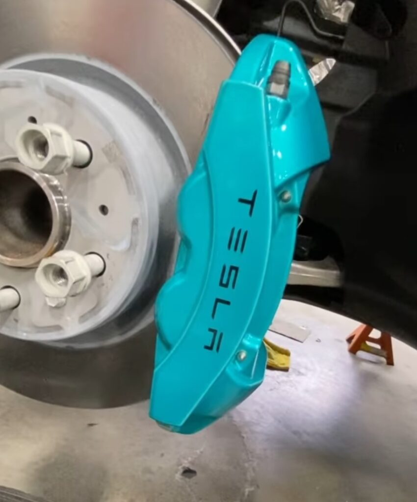 Tesla brake caliper finished in teal at Big Shot Rides in Coconut Creek, Florida